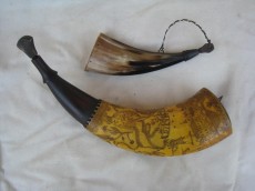 Ed Long HornsLarge horn is engraved in the “pointed tree carver style.” Flat pocket/bag horn.Photo by Ed Long
